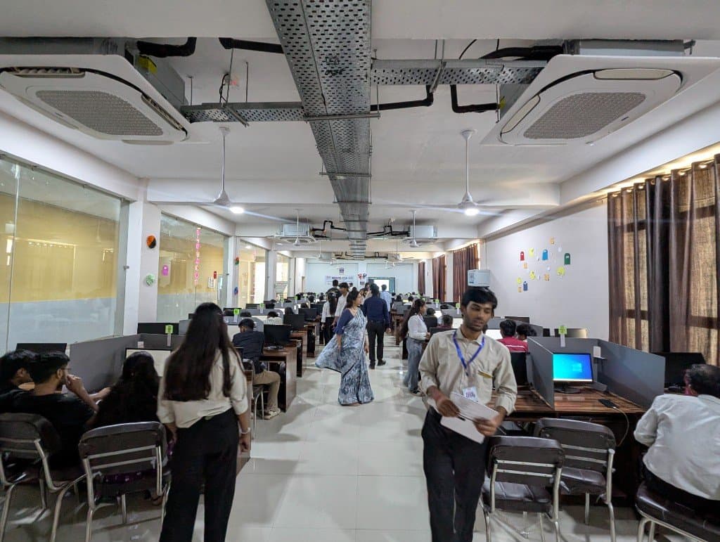The CodeLock lab during the contest, with faculty walking the aisle between computer rows.