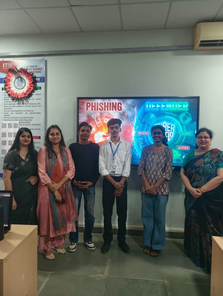 CyberForge participants and faculty in front of the Phishing Defender screen.