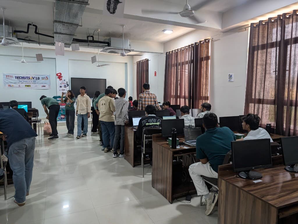 Participants standing and working at lab benches during Hacktoberfest Hack Day.